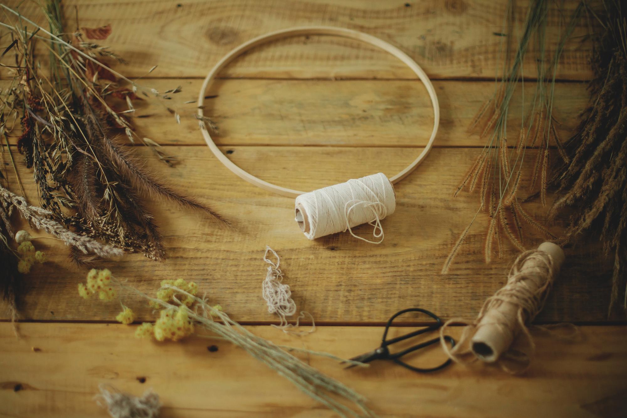 Workshop table with threads and embroidery hoop